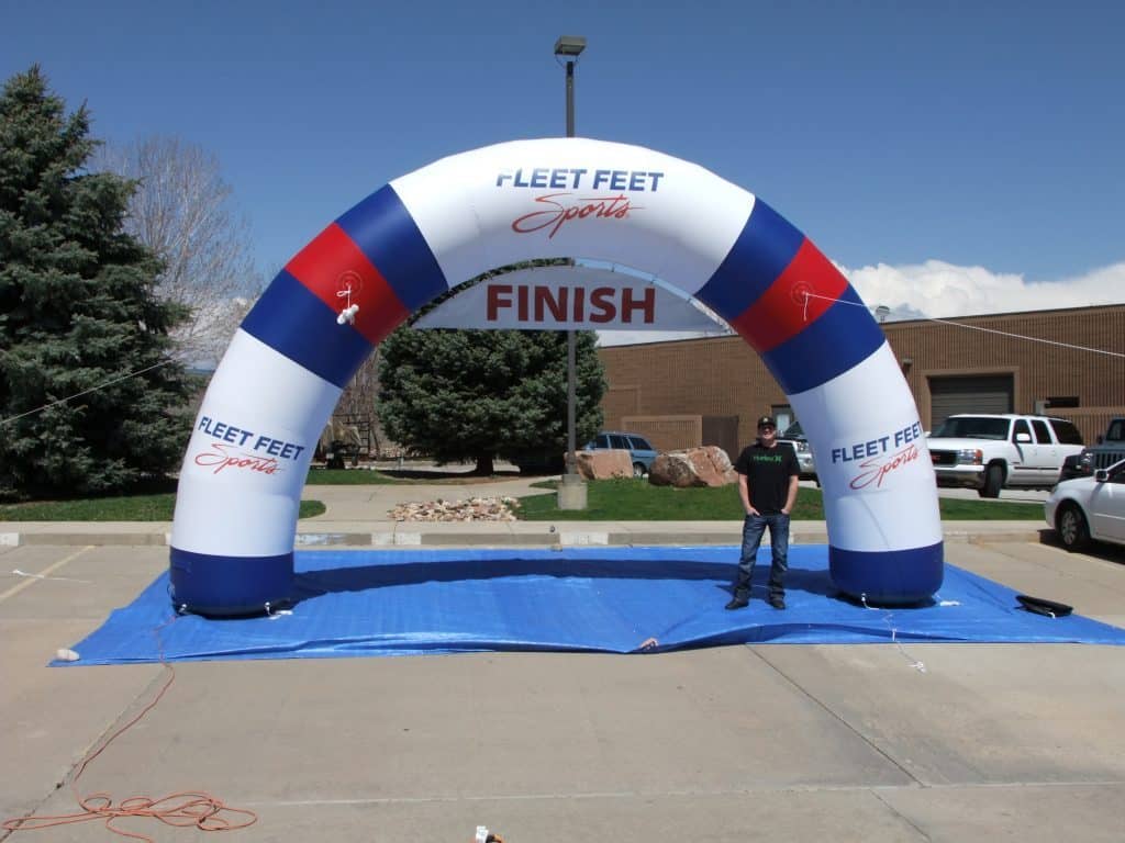 Fleet Feet Sports Curved Inflatable Arch w: Hanging Banner - Boulder Blimp