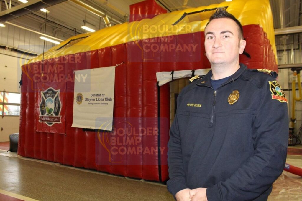 Firefighter with Inflatable Fire Education House